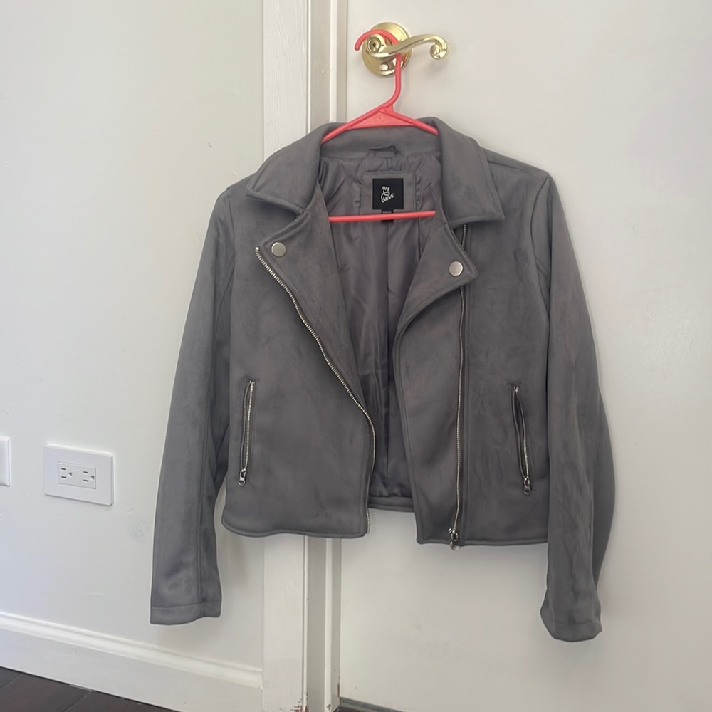 A grey jacket. Size 10/12 in kids.